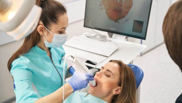 Dentist,Scanning,Woman,Teeth,With,Dental,Intraoral,3d,Scanner Dentist,Scanning,Woman,Teeth,With,Dental,Intraoral,3d,Scanner