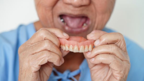 Asian,Senior,Woman,Patient,Wearing,Teeth,Denture,Into,Her,Mouth Asian,Senior,Woman,Patient,Wearing,Teeth,Denture,Into,Her,Mouth